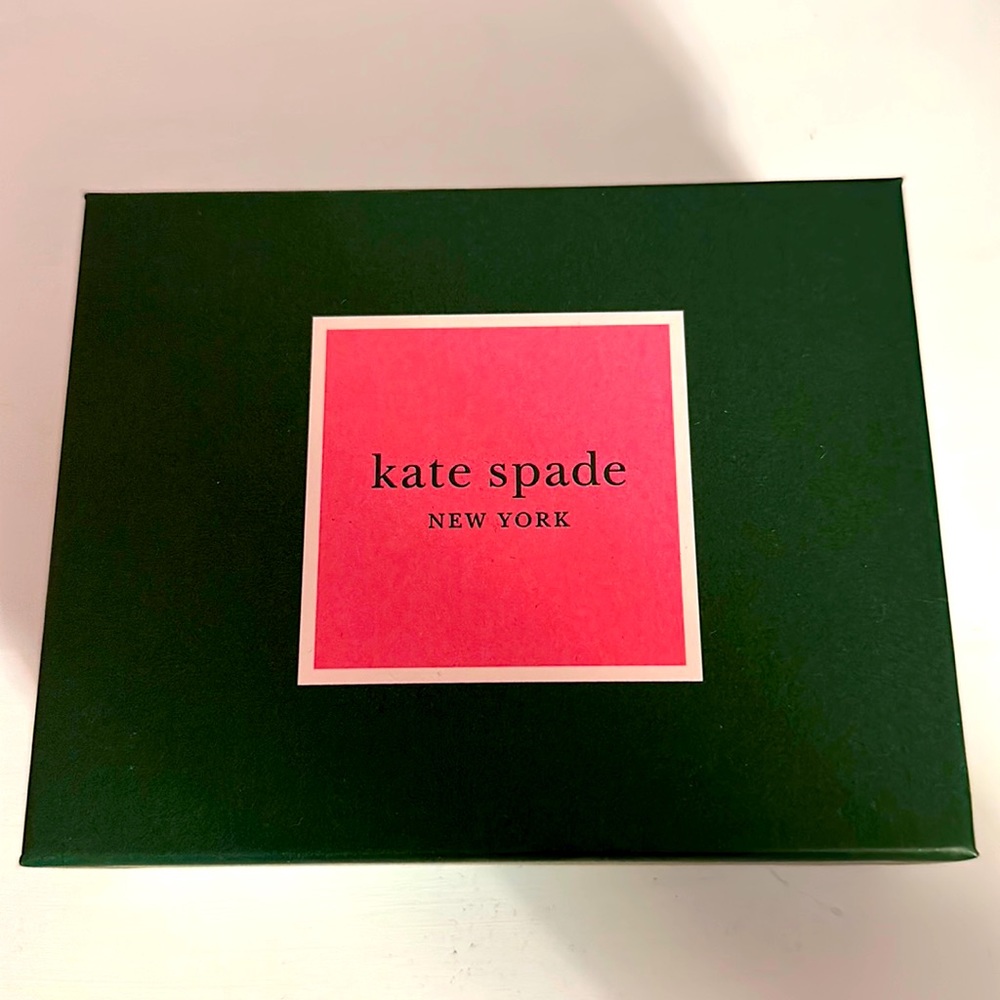 Kate spade silver bangle inside engraved with “find the silver lining”